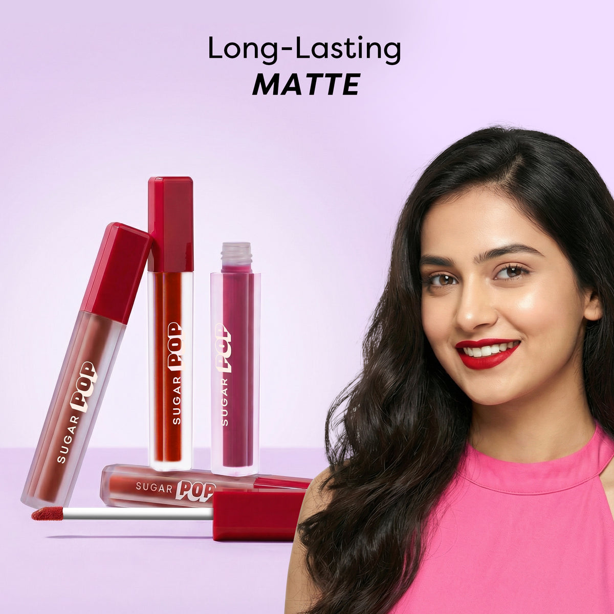 Model holding SUGAR POP Matte Lipcolour: long-lasting matte